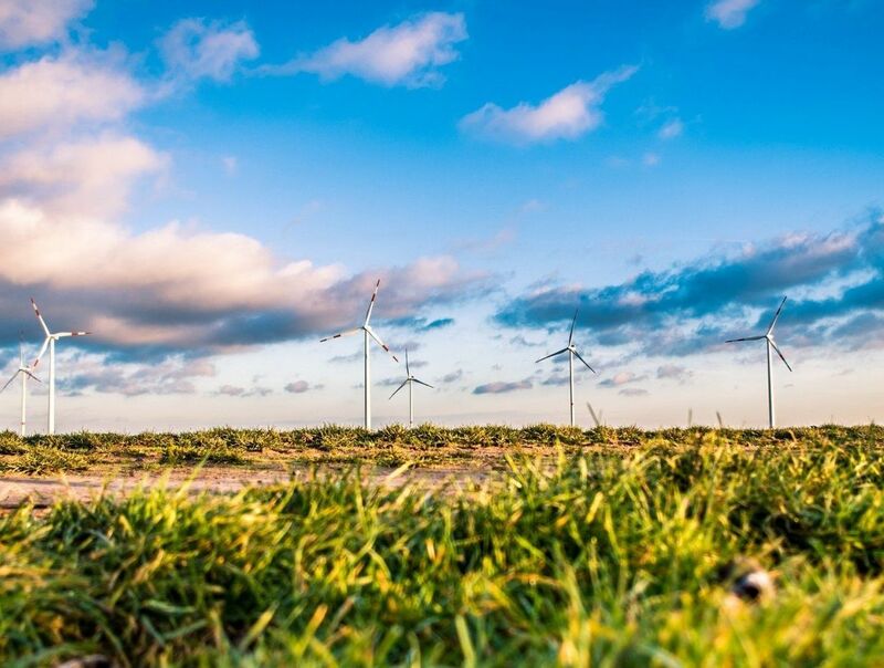 Green Energy (EV, solar, etc.) - wind mill turbine grassy field